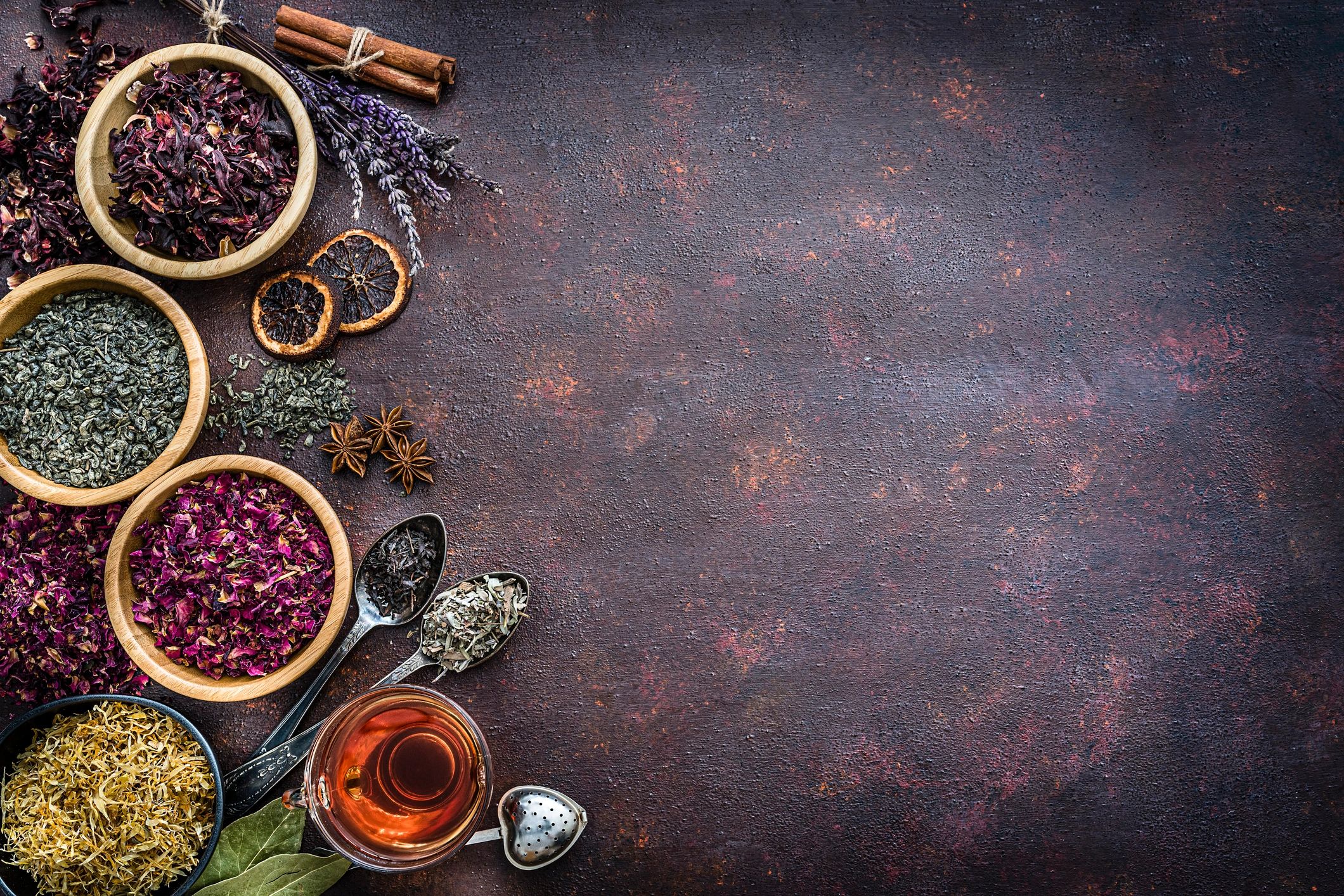 Assorted dried tea leaves and flowers flat lay