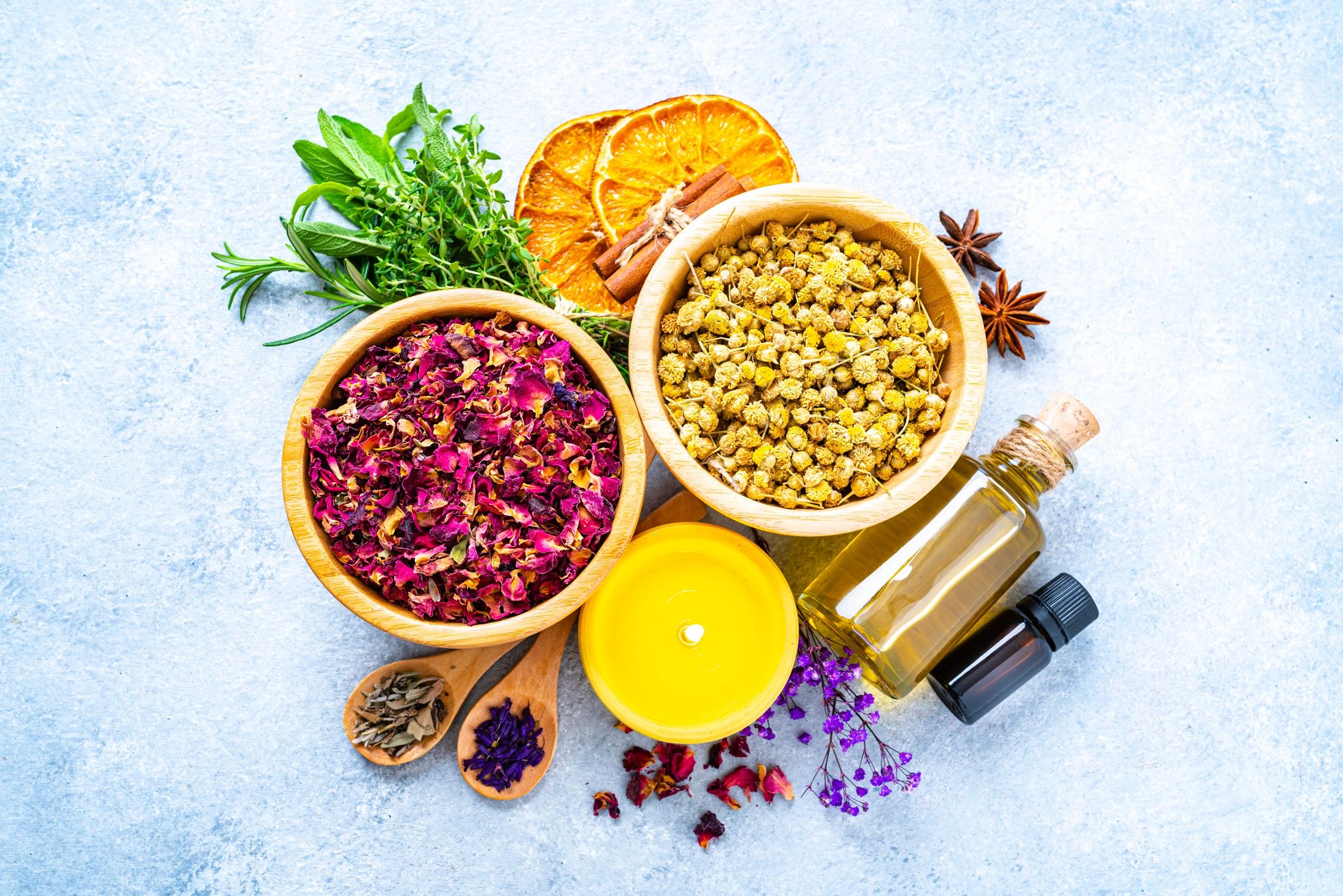 Herbal apothecary ingredients and jars arranged on a table