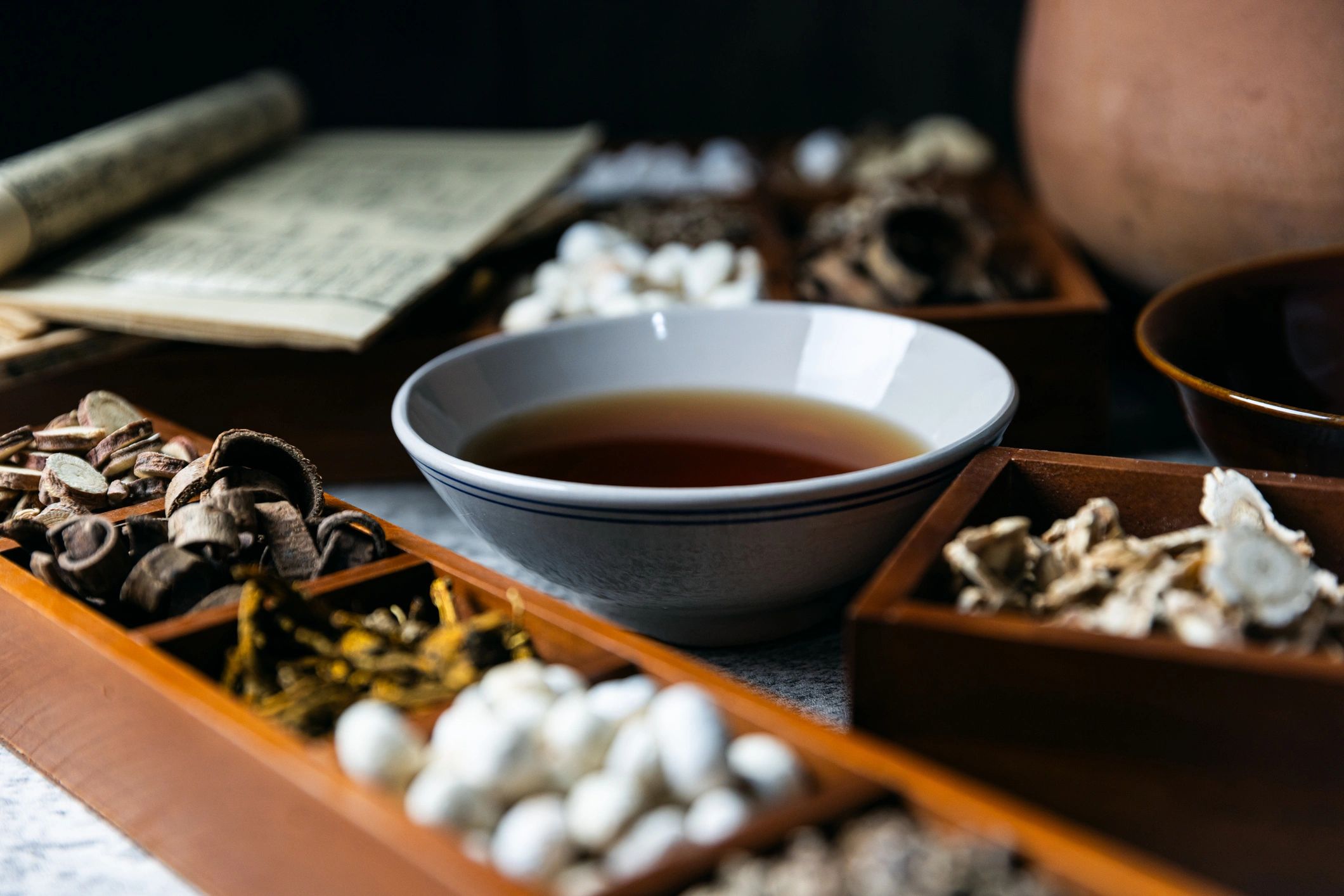 Warm-toned bowl with herbs and spices on a table