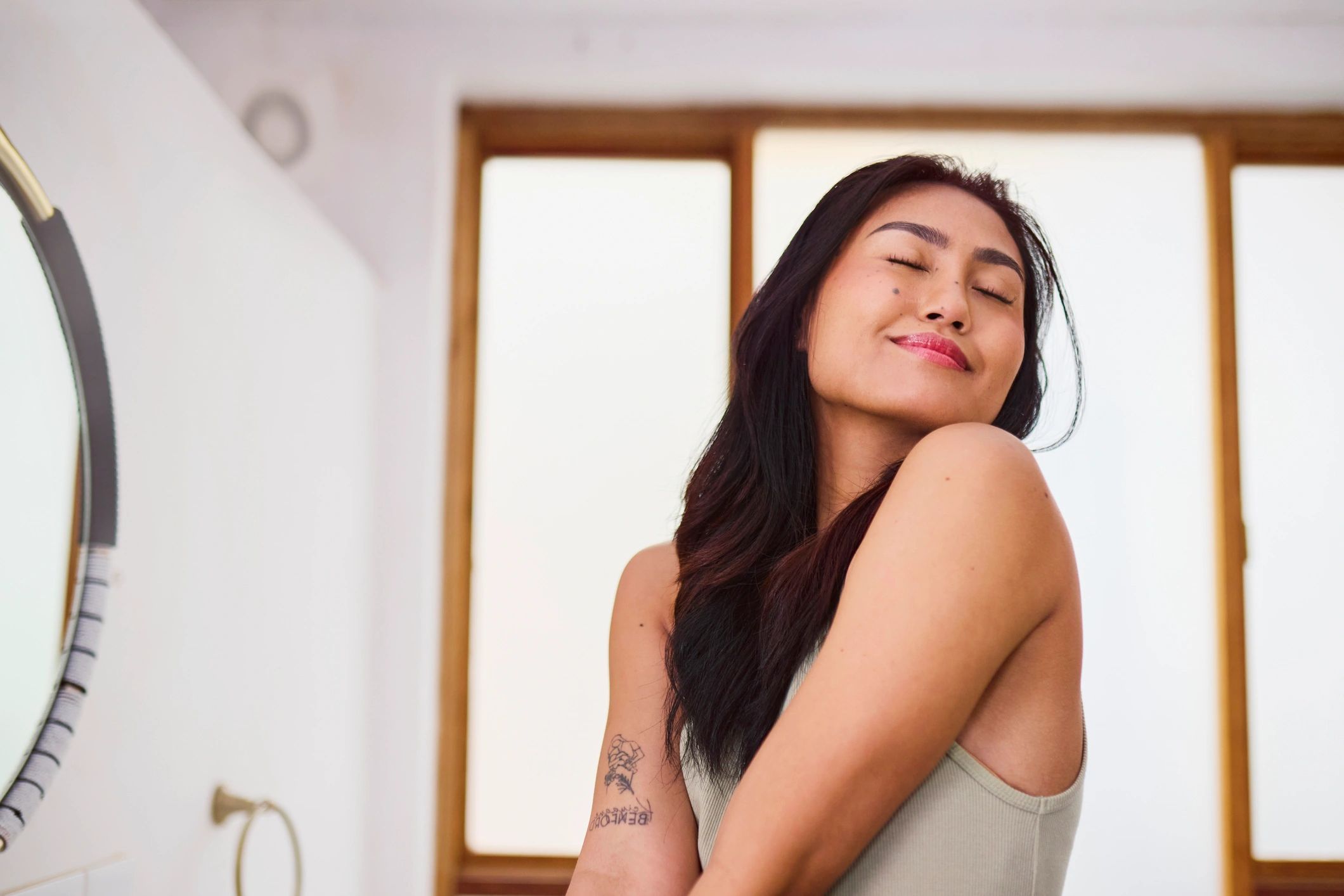 Peaceful woman in a wellness moment, eyes closed